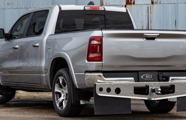 Truck with hitch-mounted mud flaps